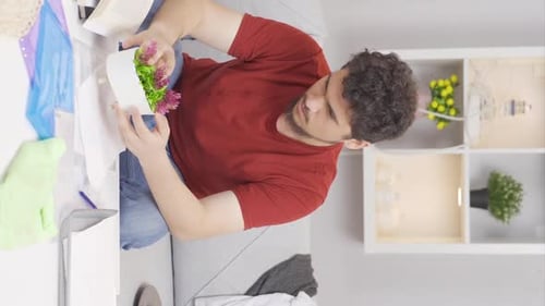 Person Arranges Artificial Flowers at Home