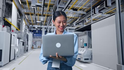 Asia Female Professional Worker Working With A Laptop at Factory Digitalization