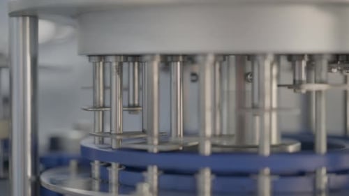 Close Up Shot Of Medical Syringes Being Assembled In A Production Manufacturing Facility.