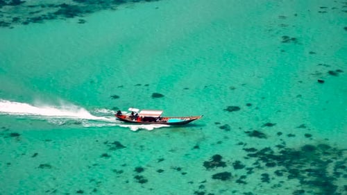 long tail boat sailing in the tropical. Beautiful summer vacation destination.