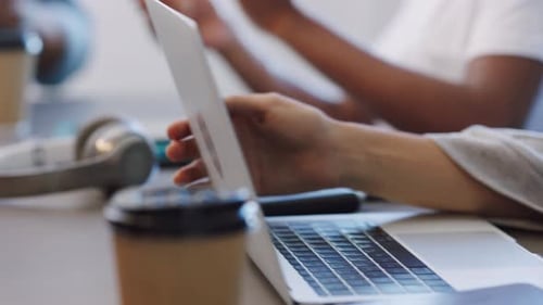 Laptop and Office Supplies on Table in Office