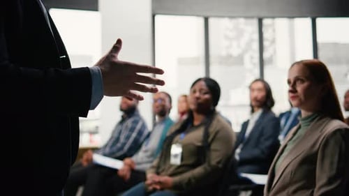 Business Summit in Conference Hall with Professional Audience Seated on Chairs