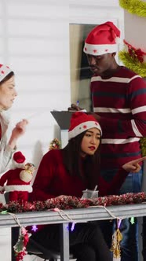 Vertical Video Manager Delegating Tasks in Xmas Office