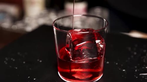 the bartender prepares a cocktail at the bar