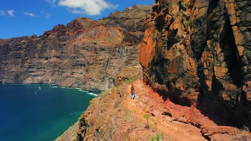 Girl Hiking Mountain by the Ocean