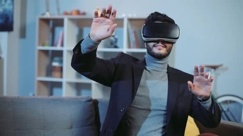 Man Experiencing Virtual Reality on Living Room Couch