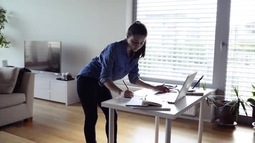 Woman Working at Home on Laptop