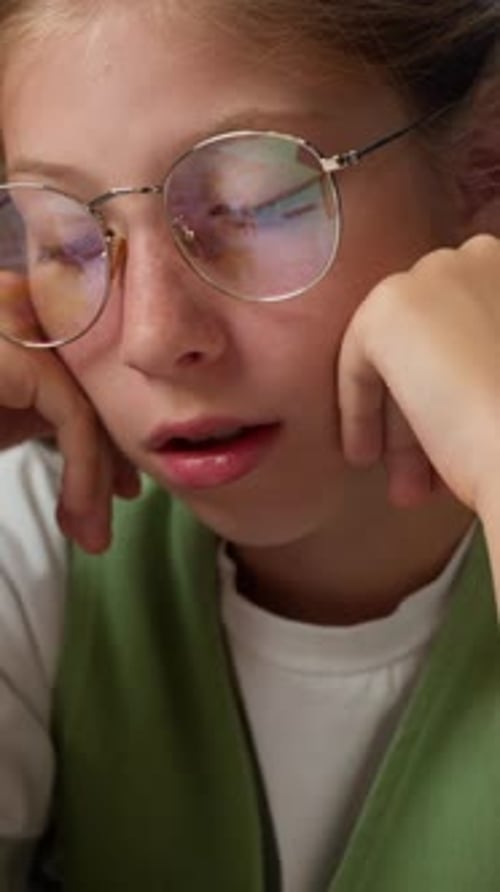 Boring Tired Caucasian Little Girl Child in Glasses with Bad Mood Education Problem Study Knowledge