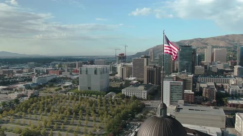 Aerial View of Cityscape with American Flag