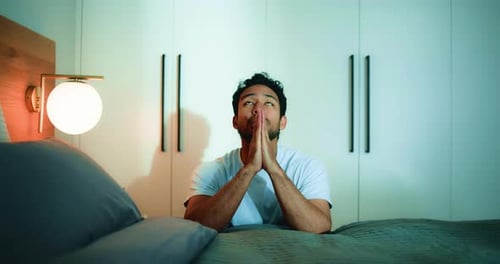Man Prays in Bedroom at Night, Gets Up