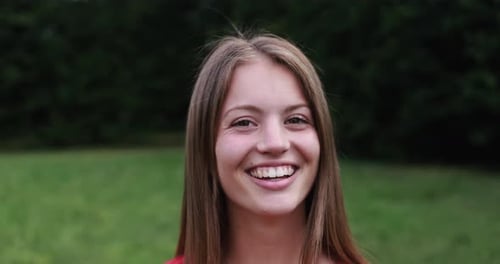 Smiling Woman in Green Park, Portrait