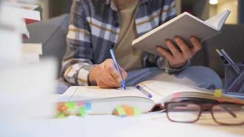 Teen working on homework in bedroom