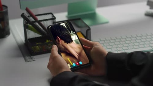 Video call on phone at office desk