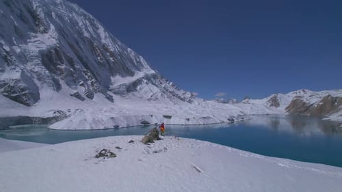 Aerial Revealing View Inspirational Solo Male Trekker Stand Admire Mountains Reaching Tilicho Lake