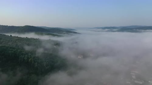 Aerial view of foggy city in autumn.