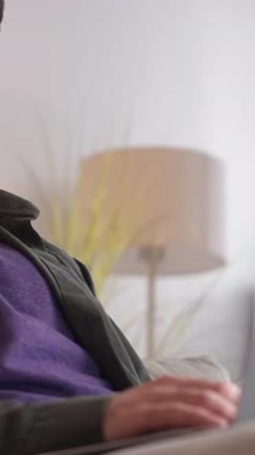 Man Ponders Thoughtfully Indoors at Home