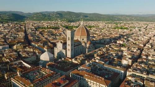 Aerial Ascending Shot of Florence Cathedral Complex and Surrounding Buildings in Historic City