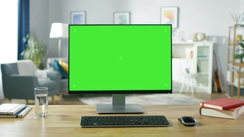 Zoom in On a Modern Personal Computer with Mock-up Green Screen Display Standing on the Desk of the