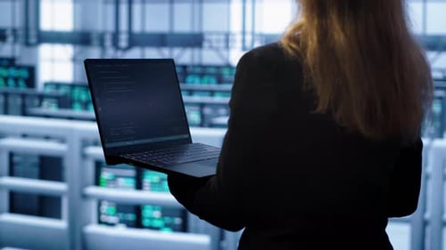 System Administrator in Server Farm Using Laptop to Patch Network Issues