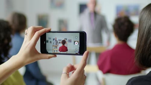 Art Auction: Collectors Bidding on Paintings