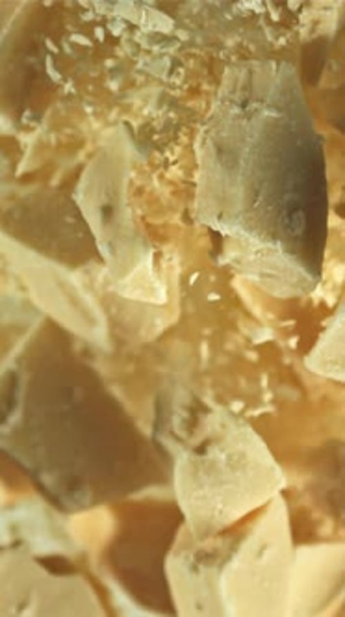 Pieces of White Chocolate Fly Up and Fall Down Filmed on a Highspeed Camera at 1000 Fps