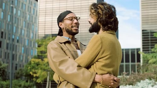 Young Adults Embracing in the City