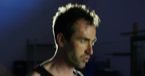 young nice man with green eyes doing exercise in the gym. passion for sports concept and healthcar