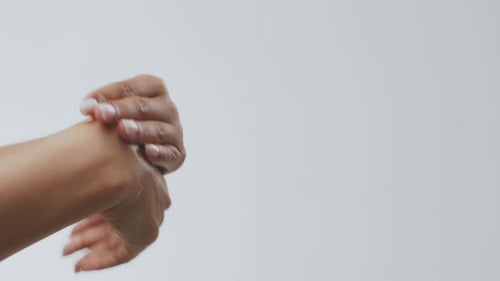 Applying Lotion to Hands for Beauty Treatment