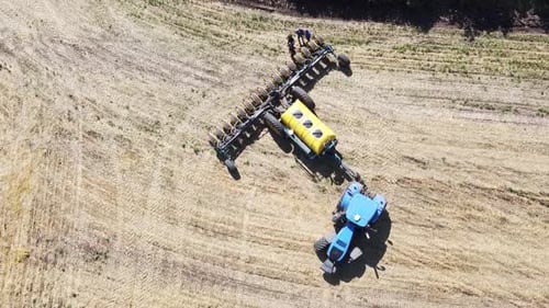 Blue Tractor O.A. Planting Canola On No Till Field