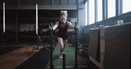 Motivation Concept Young Athletic Blonde Woman Pushing Heavy Training Sled Towards Camera Training