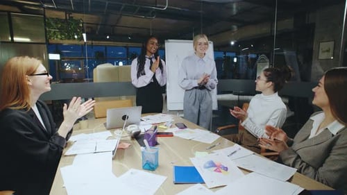 The Collaboration of a Diverse Group of Women During a Modern Office Meeting Emphasizes