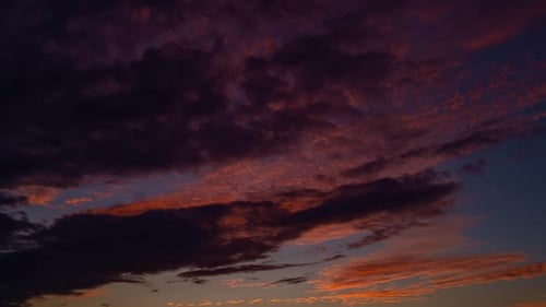 Colorful Clouds Moving Across Sky During Sunrise or Sunset