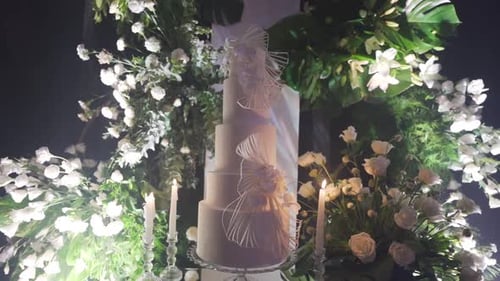 Elegant Wedding Cake Display with Floral Accents