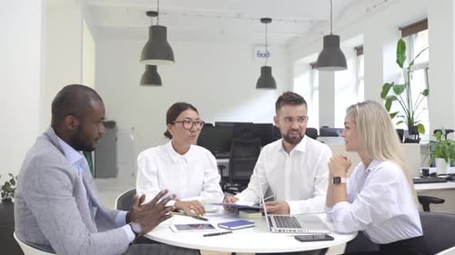 Multiethnic Business People During Meeting in Modern Office