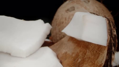 Closeup of Delicious Coconut Chunks and Whole Coconuts