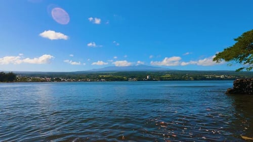 Mauna Kea Time-lapse from Hilo Bay during a sunny Hawaii Afternoon. Captured in 4K Time-lapse.