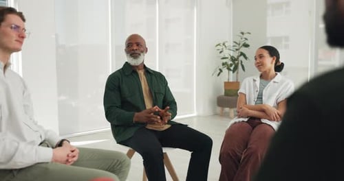 Adults Talking in Group Therapy Session