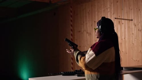 Woman Aims Handgun at the Shooting Range
