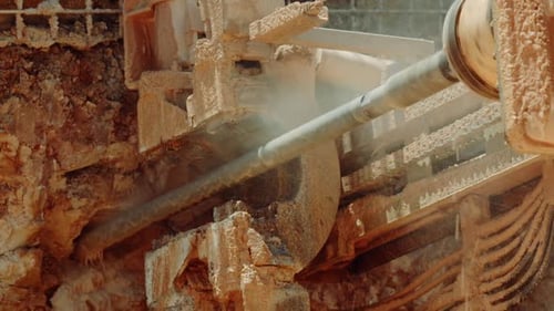 Small drilling digs into the rock.