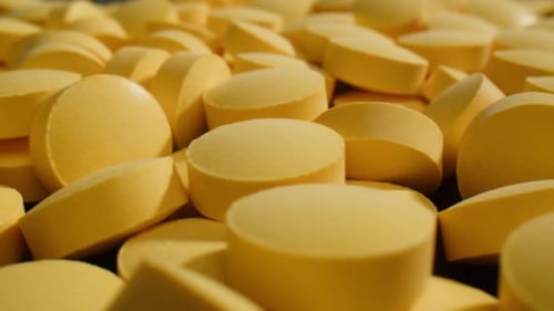 Pills and Vitamins Macro Close Up View of Womans Hands Holding Plenty of Different Drugs Painkillers
