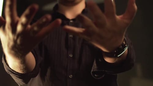 Person Gesturing with Hands in Close-Up