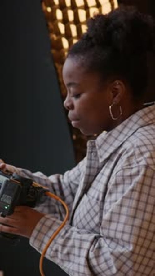 Young Photographer Working in Studio