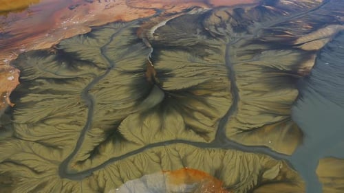 Aerial view of acid mine water drainage flow, toxic mine waters polluting nature