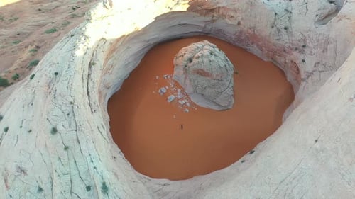 Drone Aerial View of Cosmic Ashtray, Unique Rock Formation With Sand in Utah USA
