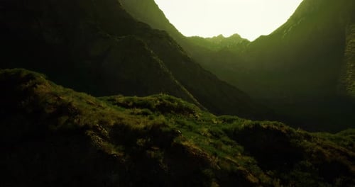 Majestic Mountain Landscape at Sunrise Revealing Lush Greenery and Peaks