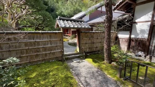 Walking Through The Entrance of Jizoinsanmon Temple In Kyoto, Japan. handheld shot