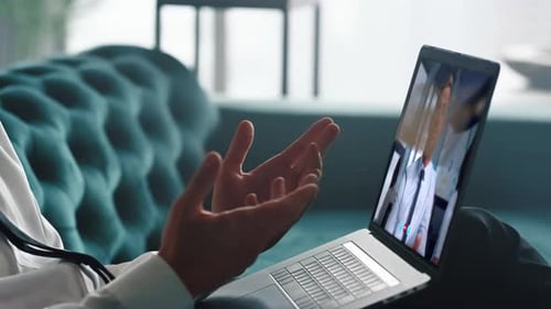 Business Partners Negotiating Video Meeting Using Laptop Webcam Close Up