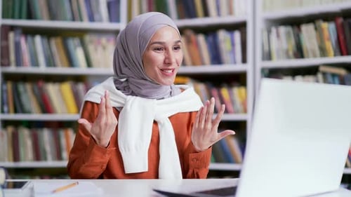 Enthusiastic Woman Video Calling With Laptop