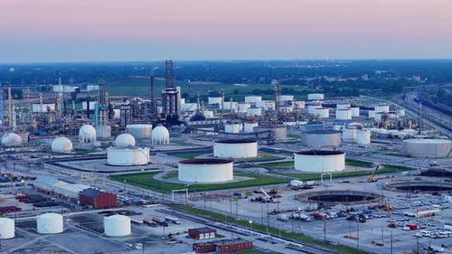 Wide aerial view of Cenovus Toledo Refinery with storage tanks and evening sky