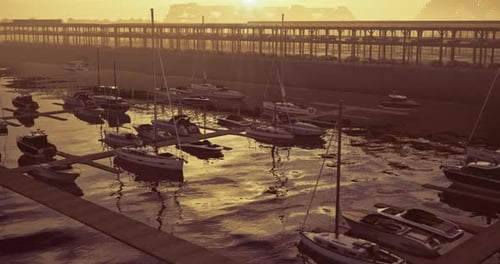 Sunset Over a Tranquil Marina with Boats Docked and Shimmering Water